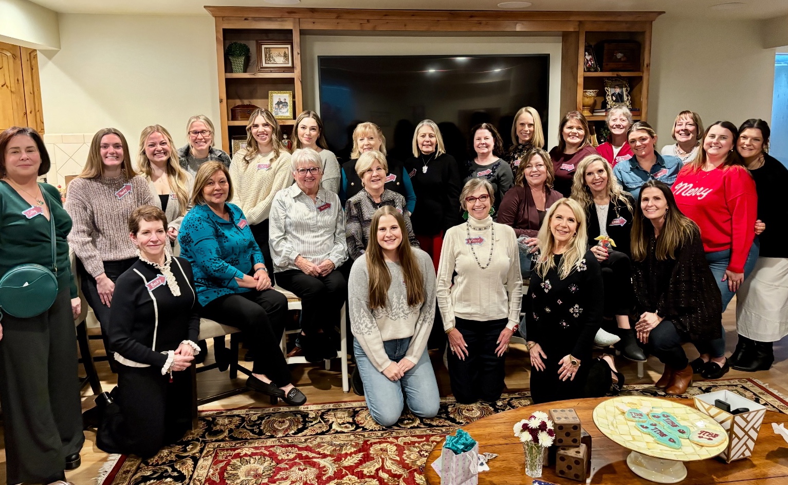 A large group of people posed indoors