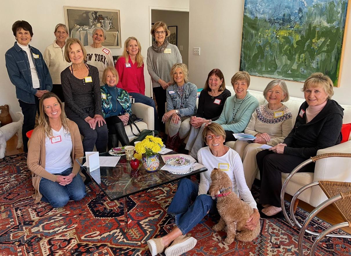 Group of several individuals indoors seated on couches