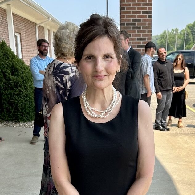 Photo of Kathleen Kyle wearing a black dress