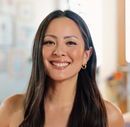 Professional headshot of Amy Liu with long dark hair in front of a blurred backgrounf