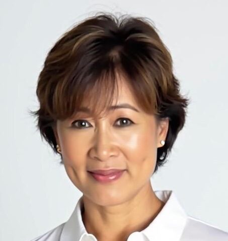 Professional headshot of Carol Lin wearing a white collared shirt in front of a white background