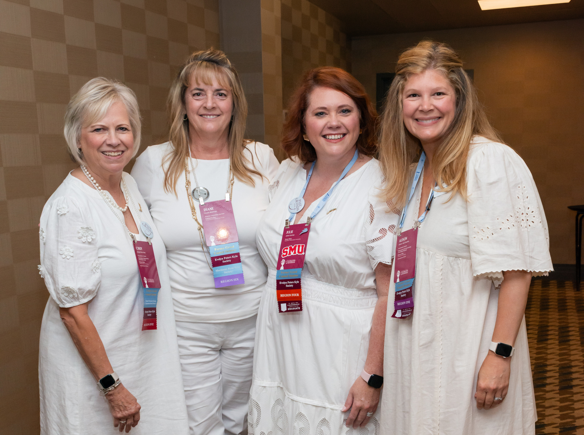 Four members wearing white