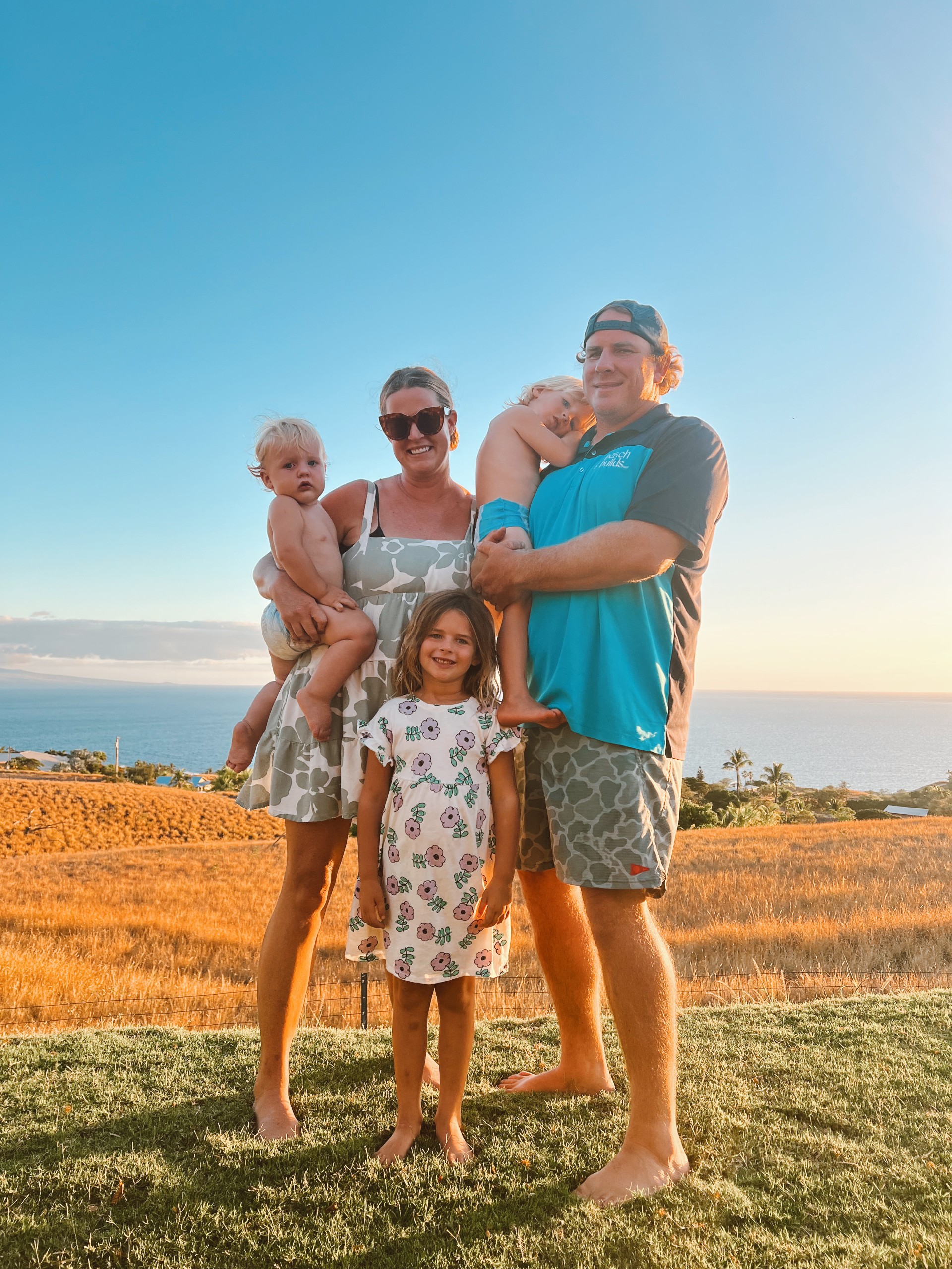 A family standing in an open field