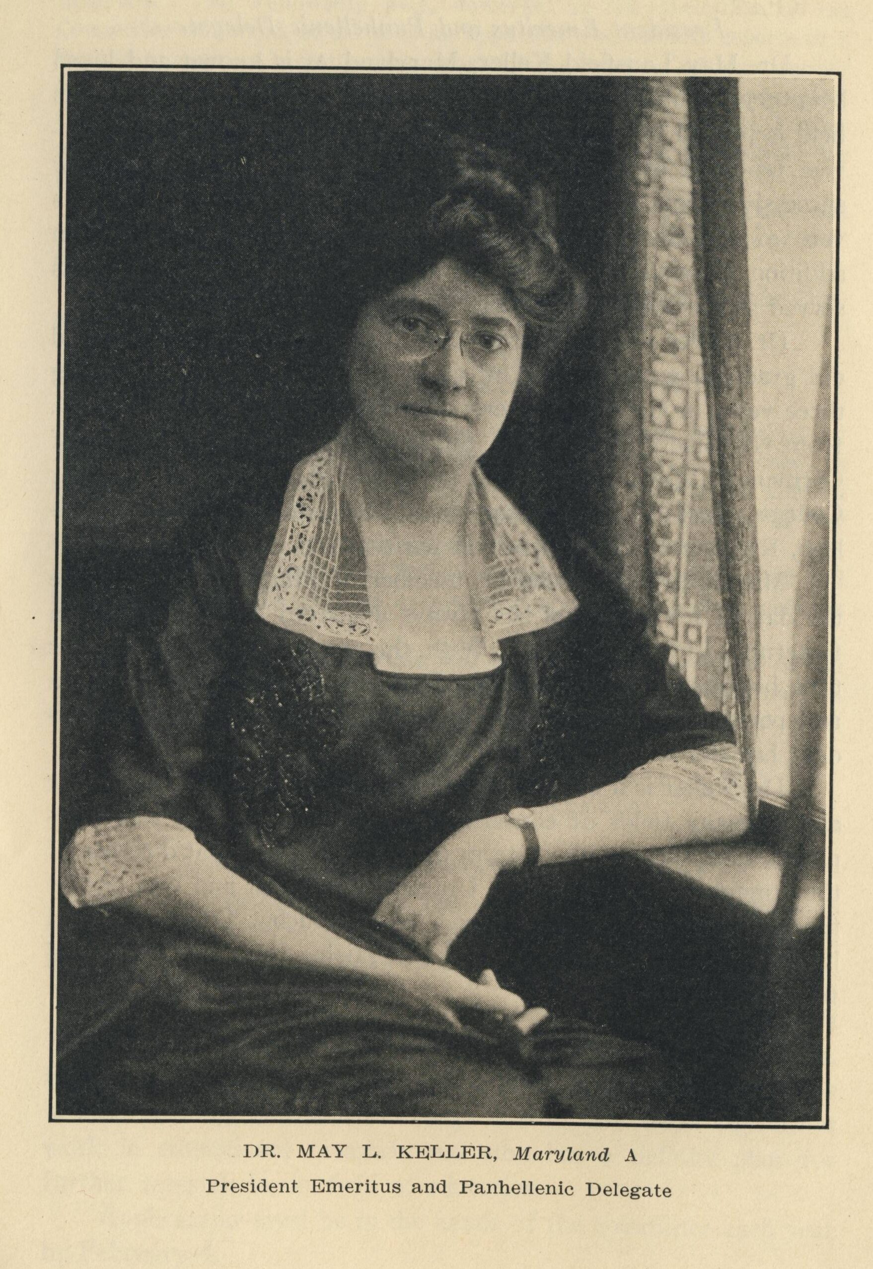 Professional headshot of May Lansfield Keller sitting near a windowsill
