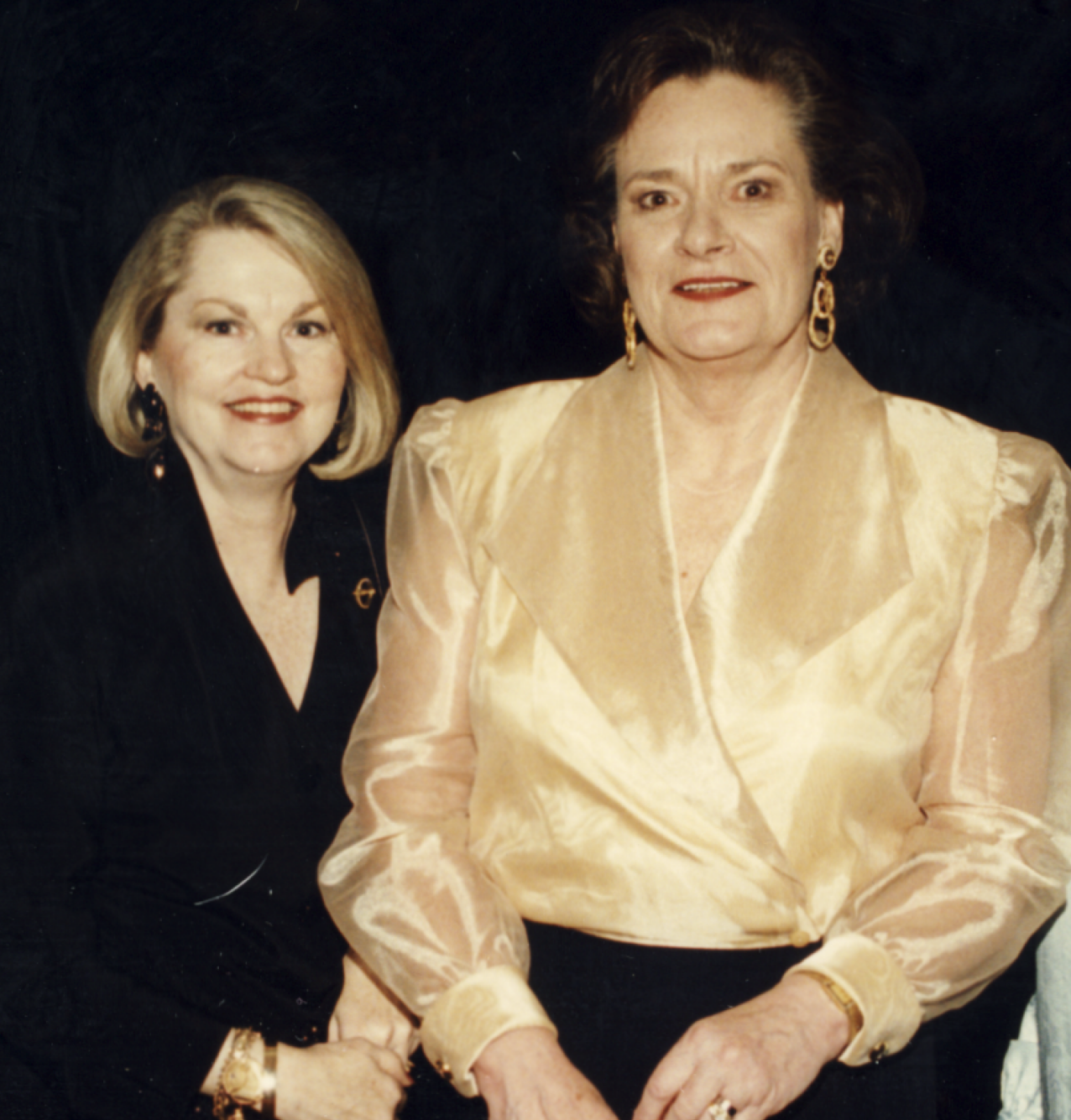 Two members standing next to one another