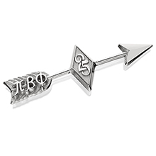 A silver arrow pin that has a diamond with 25 in the middle of the arrow and the Pi Beta Phi Greek letters on the shaft