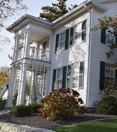 Exterior of Holt House with historical landmark signage