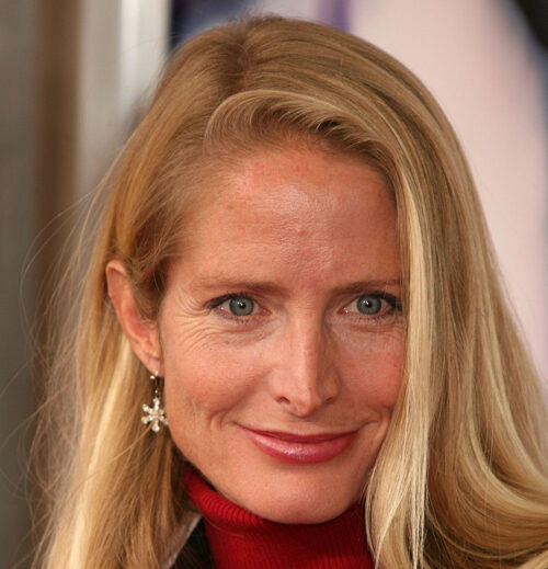 Close up head shot of American actress Jane Sibbett wearing a red turtleneck