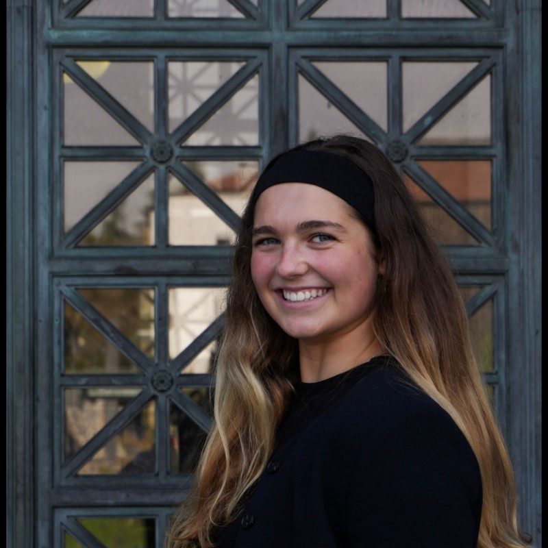 Photo of Sierra Palese standing in front of a glass door