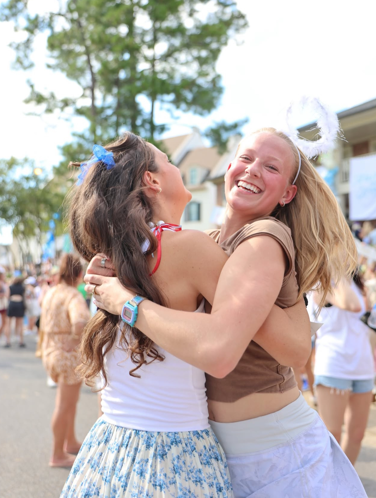 Two members jumping and hugging