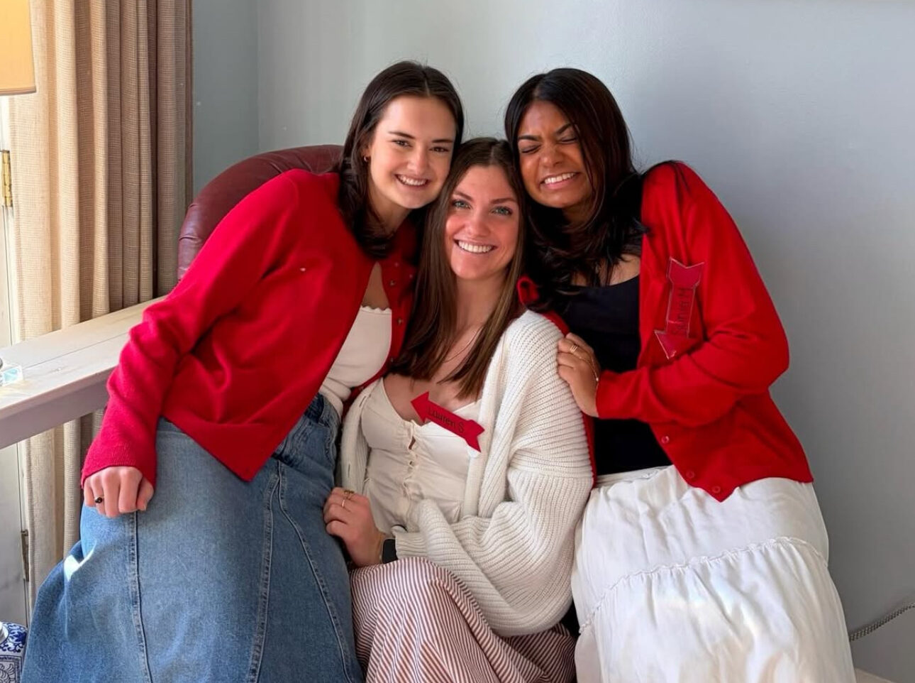 Three members hugging