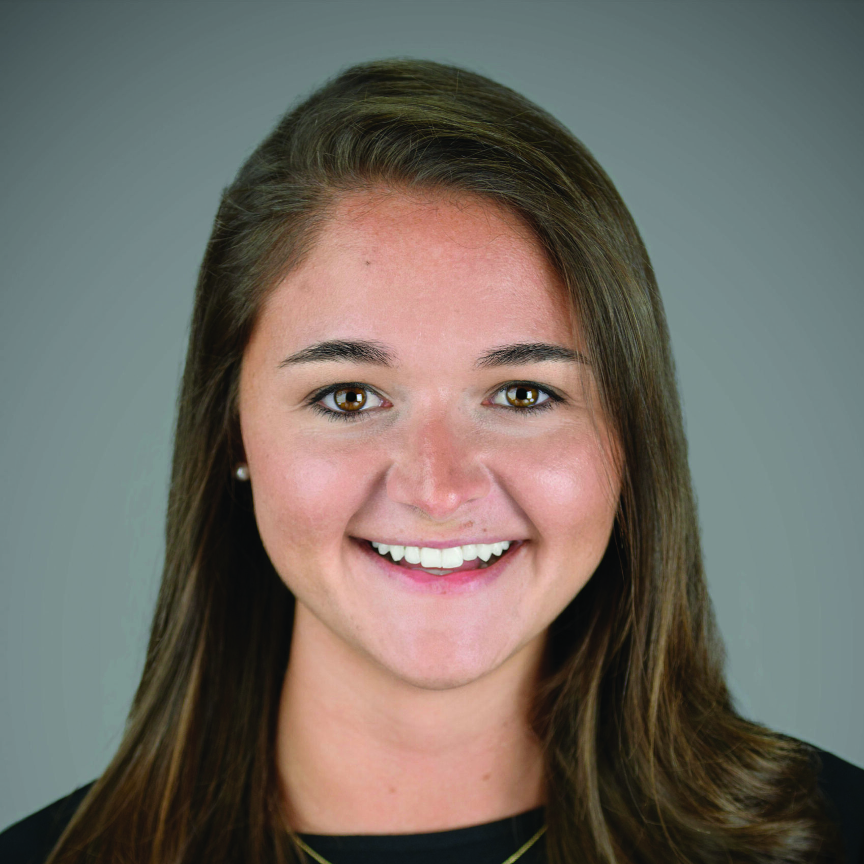 Professional headshot of Kathleen Meriano wearing a black blouse