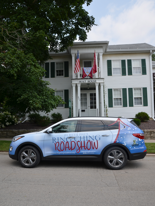 Libbie from the Ring Ching Roadshow in front of Holt House