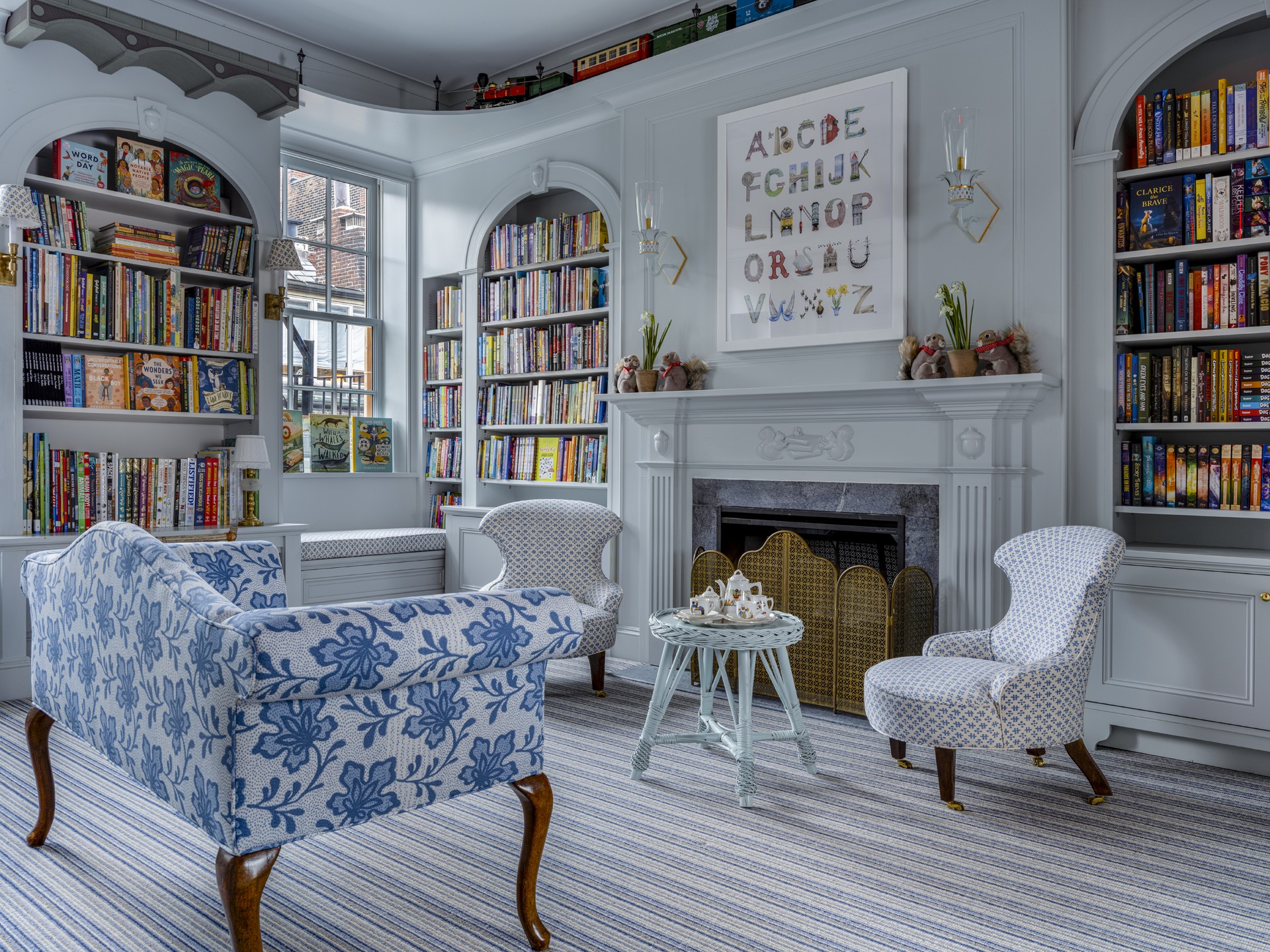 Image of an indoor seating area surrounded by books